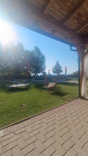 a view of a park with a bench in the grass at Victorian Heights in Tetovo