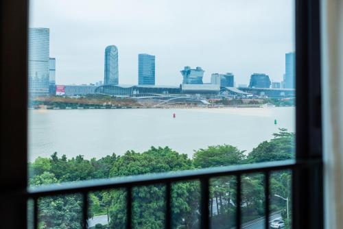a view of a large body of water from a window at Linjiang Shangpin Apartment in Guangzhou