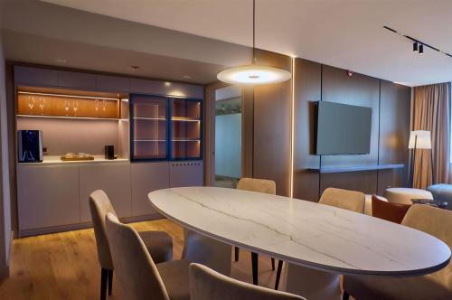 a conference room with a white table and chairs at Hilton Buenos Aires in Buenos Aires