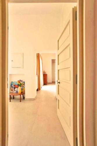 a hallway with a hallway leading to a room at Last Minute Rooms Lecce in Lecce