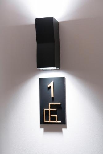 a sign on a wall with a number one on it at Ca Gracia Bocairent in Bocairent