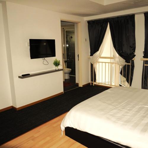Postel nebo postele na pokoji v ubytování Free Stay Ayeh Keroh