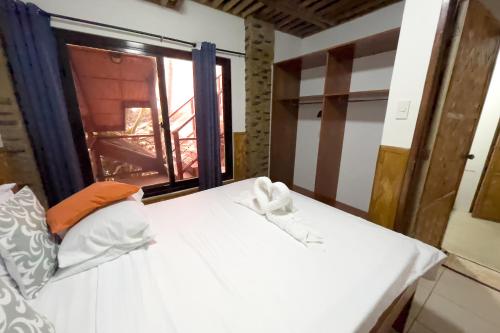 Postel nebo postele na pokoji v ubytování Villa de Pico Highland Beach Resort