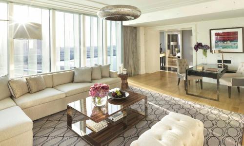 a living room with a couch and a table at Four Seasons Hotel Abu Dhabi at Al Maryah Island in Abu Dhabi