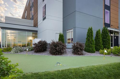 a building with a golf course in front of it at SpringHill Suites by Marriott Kalispell in Kalispell