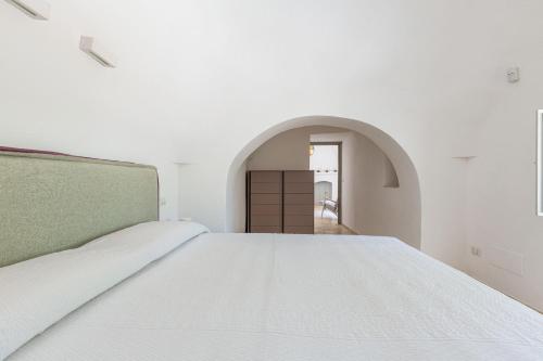 Ένα ή περισσότερα κρεβάτια σε δωμάτιο στο Il Trullo di Cimaglia by Perle di Puglia