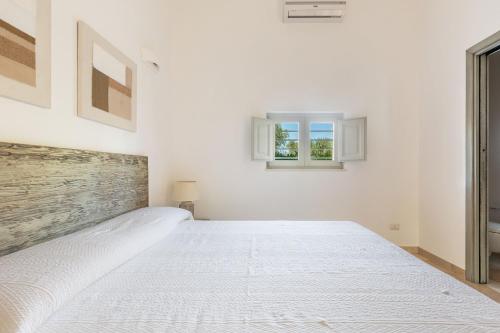 Ένα ή περισσότερα κρεβάτια σε δωμάτιο στο Il Trullo di Cimaglia by Perle di Puglia