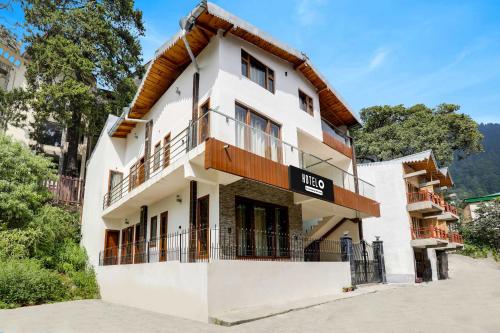 a building with a sign that reads hotel at Hotel O Mall Road Nainital in Nainital
