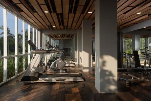 a gym with treadmills and elliptical machines at Swiss-Belresort Belitung in Tanjungbinga