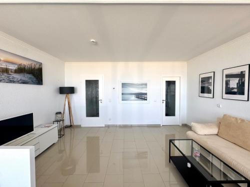 TV a/nebo společenská místnost v ubytování Ferienwohnung Oceanview Marina Wendtorf