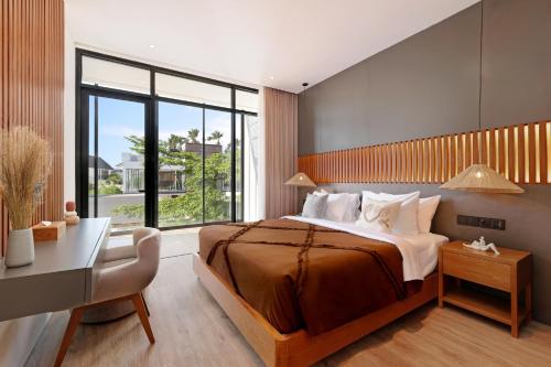 Giường trong phòng chung tại Aquamarine Villas by BREIG