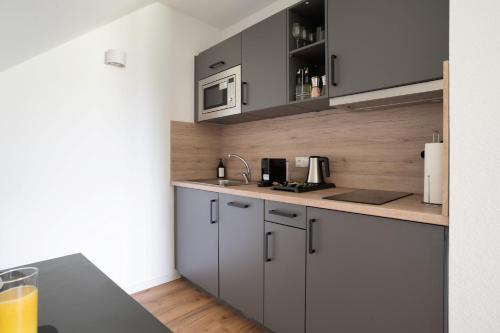 Dapur atau dapur kecil di Schöne Apartments in Lohne I home2share