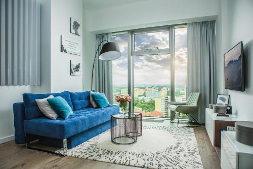 Гостиная зона в In The Sky - Apartamenty w Sky Tower