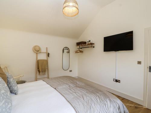 Ένα ή περισσότερα κρεβάτια σε δωμάτιο στο The Little Loft