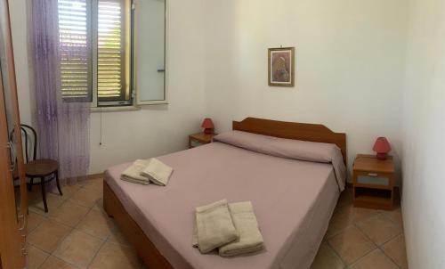 Ένα ή περισσότερα κρεβάτια σε δωμάτιο στο Villa Kore