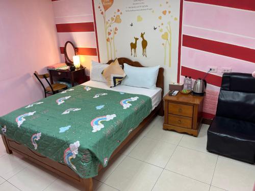 Cama o camas de una habitación en 暖暖旅宿