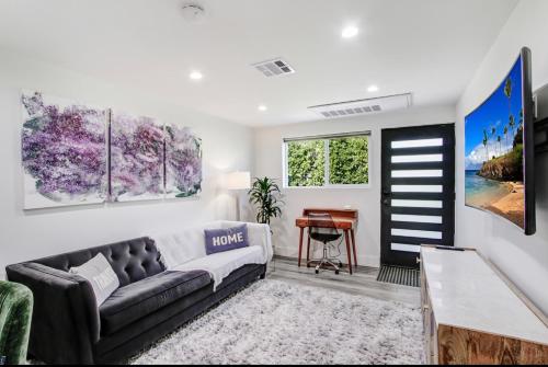 a living room with a couch and a table at Wellness Temple LA in Tarzana