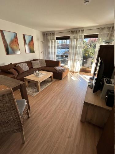 a living room with a couch and a table at Bergfeuer in Garmisch-Partenkirchen
