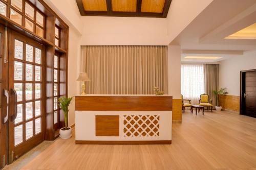 an office lobby with a podium in the middle at Keys Select by Lemon Tree Hotels, Kufri, Shimla in Shimla