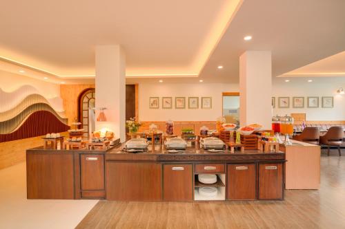a kitchen with a large island in a room at Keys Select by Lemon Tree Hotels, Kufri, Shimla in Shimla