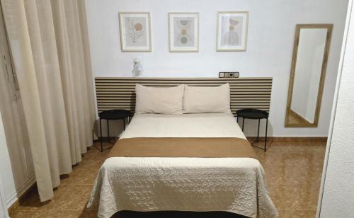 Postel nebo postele na pokoji v ubytování Hostal Prada