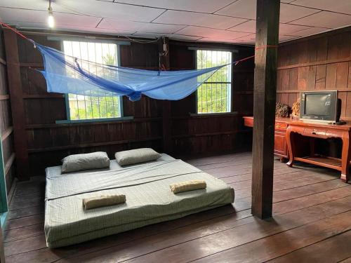 Katil atau katil-katil dalam bilik di Lazy Mango Home Stay