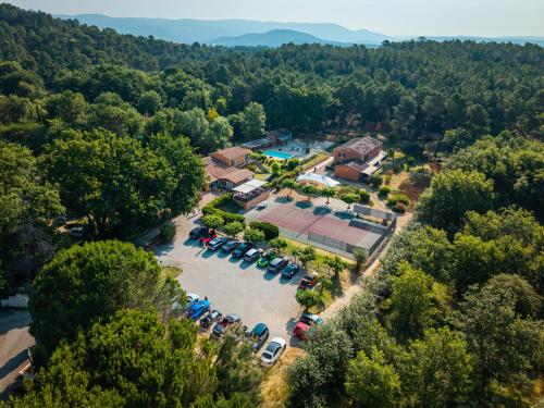 an aerial view of a parking lot with cars at Hotel Les Ambres in Roussillon