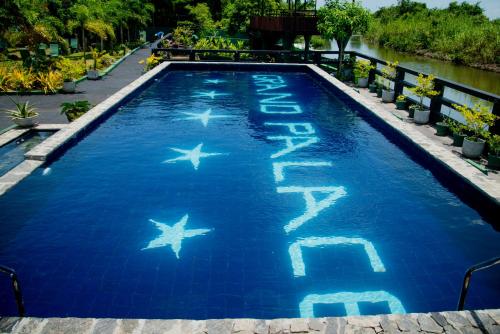 a swimming pool with stars in the water at Grand Palace Hotel, Seeduwa in Seeduwa