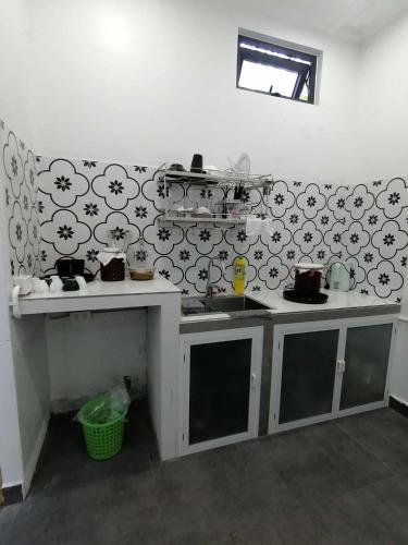 a kitchen with a counter and a sink in a room at Orange Beach House in Phú Quí (2)