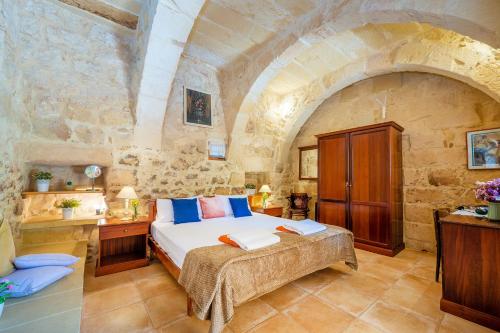Ένα ή περισσότερα κρεβάτια σε δωμάτιο στο Razzett Matli Holiday Home