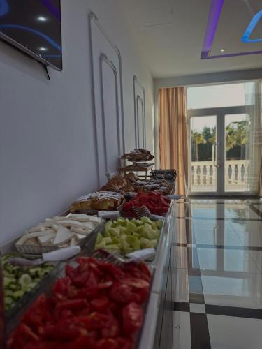 a buffet line with different types of food on display at Kompleksi Exalco-Al in Shkodër