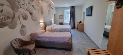 Ένα ή περισσότερα κρεβάτια σε δωμάτιο στο B&B Villa Dina