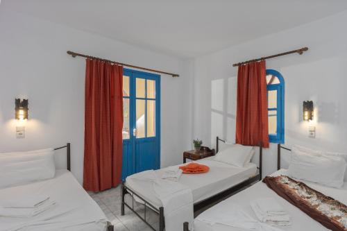 Ένα ή περισσότερα κρεβάτια σε δωμάτιο στο Palm Bay Sissi Hotel