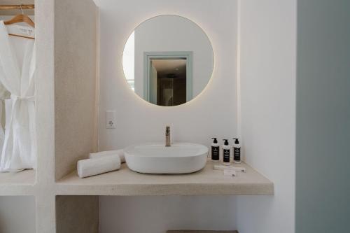 a bathroom with a sink and a mirror at Naxos Tower in Naxos Chora