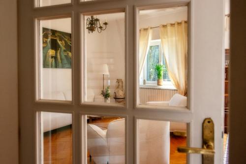 a view of a living room through a window at Villa Mediteran in Split