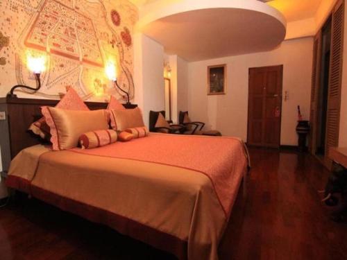 Postel nebo postele na pokoji v ubytování Karinthip Village