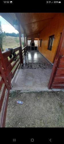 an empty hallway of a building with a bottle on the ground at Cabana Diana Dealul Frumos in Hănăşeşti