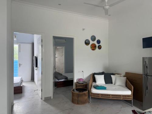 a living room with a couch and a bedroom at NZ Luxury Villa's # 3 in Mohali