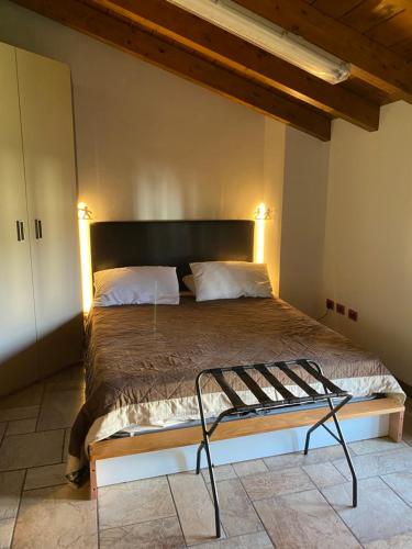 a bedroom with a large bed with two pillows at Casa Mauro in Gravedona