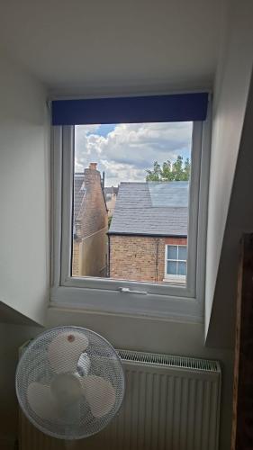 a window with a view of a building at Castle Room in Windsor