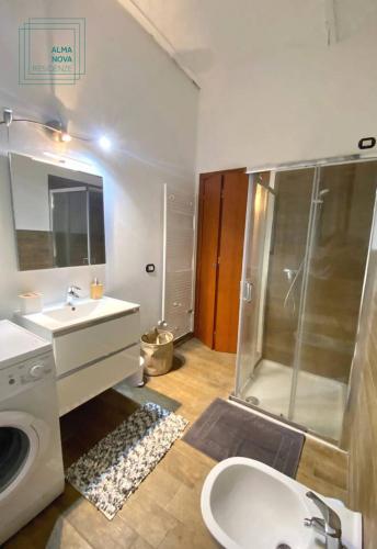 a bathroom with a shower and a sink and a toilet at Residenza Corrado in Mantova