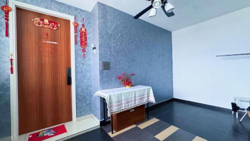 a room with a table and a ceiling fan at Zeta Residence One South with City View n Private Lift, Seri Kembangan Selangor in Serdang