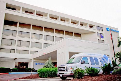 a white van parked in front of a hospital at Wyndham Indianapolis Airport in Indianapolis