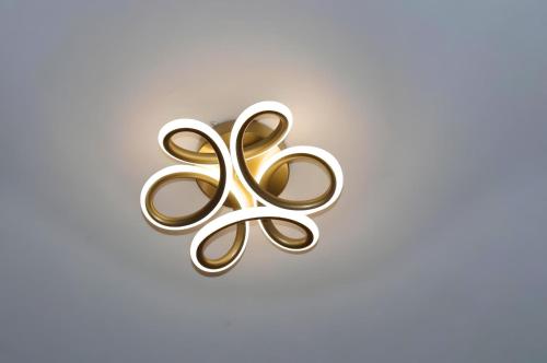 a gold and white symbol of the olympics at Staylah Sanctuary 1br in Wilma Tower Apartment- Kilimani in Nairobi