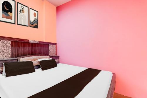 Postel nebo postele na pokoji v ubytování Hotel O SK Grand