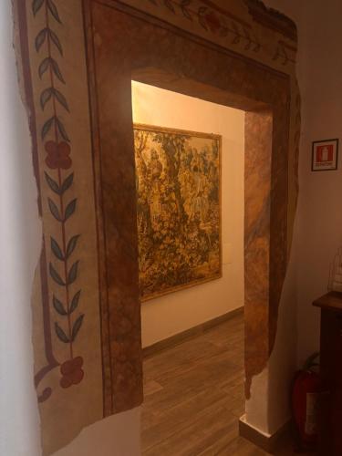 a room with a painting on the wall at Affittacamere In centro in Gubbio