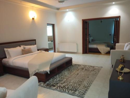 a bedroom with a bed and a large mirror at CHK INN by ChenOne in Lahore