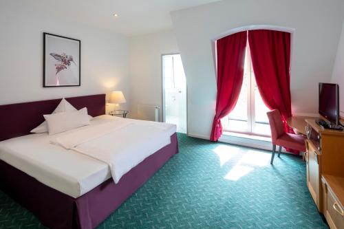 Un ou plusieurs lits dans un hébergement de l'établissement Hotel Artrium am Park