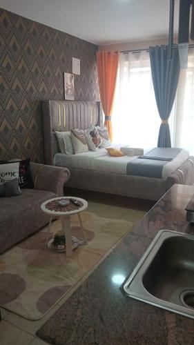 Postel nebo postele na pokoji v ubytování Budget bliss bnb ruaka1