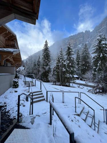 a group of benches covered in snow on a mountain at Alpine Creek - Luxury Ski-in Avoriaz Morzine in Morzine